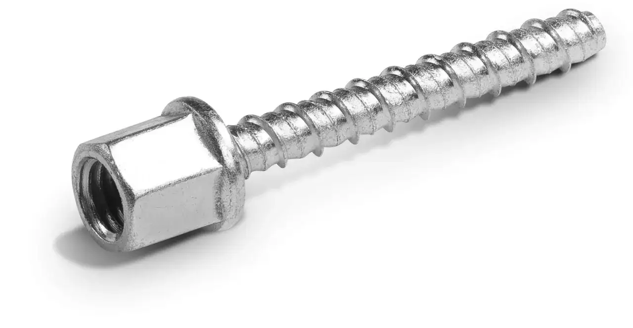 Metalowy wkręt do betonu z gwintem i sześciokątnym łbem.